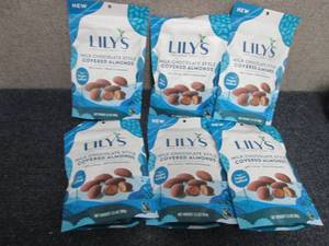 lot 98 image: 6- 3.5 oz Bags Lils Milk Chocolate...
