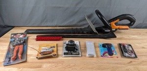 lot 150 image: Assortment of Tools Worx 24v Hedge Trimmers, Ice Scraper, Head Lamp, Tubing Joiner, Lighter and More - N