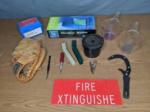 lot 275 image: Mixed Lot NOAA Weather Radio, Holiday Baseball Glove, Measuring Cups, Jar Opener, Knives and More - X