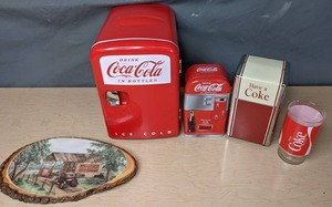 lot 419 image: Assortment of Coca Cola Collectibles Wooden Art Piece, Glass, Napkin Dispenser, Micro Fridge, Tin - V