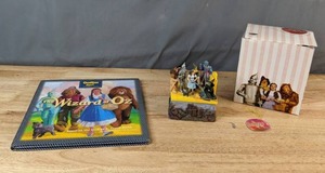 lot 625 image: Westland Giftware Wicked Witch of the West Melting Trinket Box and Wizard of Oz OshKosh Bgosh Book - V