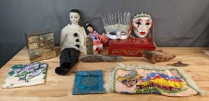 lot 626 image: Large Mixed Lot Ceramic Face with Musical Notes & Keyboard, Mulan Doll, Porcelain Harlequin Crying Clown Doll, Ice Queen Half Mask, Vintage Wood Music Box, and More - V