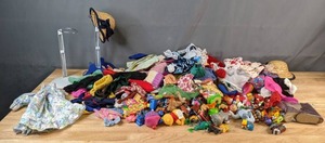 lot 615 image: Mixed Lot of Doll Clothes, Doll Stands and Toys - V