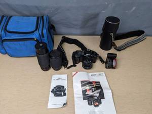 lot 680 image: Vintage Nikon N4004S Camera with (3) Lenses - V