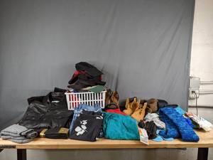 lot 675 image: Huge Assortment of Womens Clothes Boots, Sandals, Leather Jacket, Pants, Mittens, Hats, Gloves, Sock and More - V