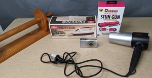 lot 743 image: Mixed Lot Wooden Paper Towel Holder, Canon Powershot SD1300 IS, Regal Electric Knife, Diablo Stun Gun and More - V