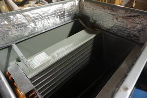 lot 87 image: Rheem Brand Model RCFLHM  2417CC 2 Ton Cased Air Conditioning Coil