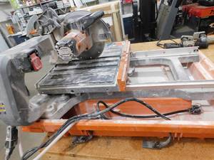lot 13 image: RIDGID 9 Amp Corded 7 in. Wet Tile Saw with Stand