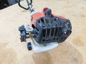 lot 51 image: Homelite 2-Cycle 26 CC Straight Shaft Gas Trimmer