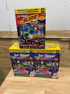 lot 168 image: STAR SHOWER Lot of 2 Star Shower Motion Laser Lights with Holiday Slide Show