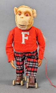 lot 26 image: 1950s Frankie the Roller Skating Monkey