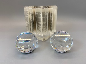 lot 49 image: Two Vintage Swarovski Crystal & One Lucite Bonds Booklet Paperweight
