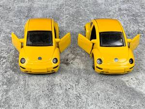 lot 302 image: Two Yellow Die-Cast VW New Beetle Toy Cars 1998 and Like-New Red Car Cake Mold