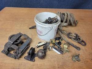 lot 587 image: Bucket full of Vintage Window Locks Pulleys and Rope
