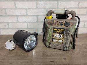 lot 625 image: Stanley JumpiT 600A Jump Pack and Battery Spotlight - Both Are in Working Condition and Include Chargers