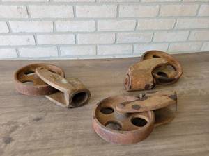 lot 667 image: (3) Antique Cast Iron Caster Wheels - Maybe for a Nutting Cart - Wheels are 8 Diameter x 1.75 Width - 2.25 Diameter Mounting Hole on Top