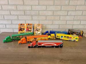 lot 902 image: Lot of NASCAR Transporter Semi Trucks, Caterpillar Car and Matchbox Cars