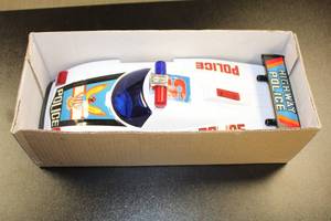 lot 33 image: Vintage Bump-N-Go Highway Police Battery Operated Car