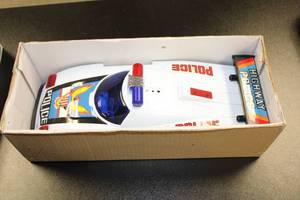 lot 34 image: Vintage Bump-N-Go Highway Police Battery Operated Car