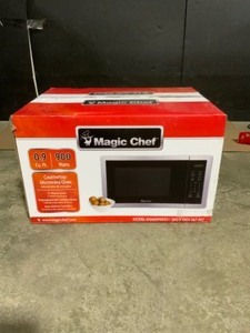lot 30 image: Magic Chef 0.9 cu. ft. Countertop Microwave in Stainless Steel with Gray Cavity. See Pictures