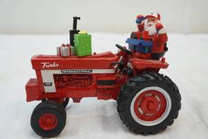 lot 64 image: Farmall Harvest figurine tractor