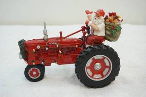 lot 65 image: Farmall Harvest figurine tractor