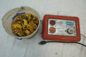 lot 209 image: Stocky electric fencer and fencer staples