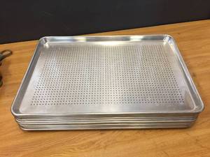 lot 64 image: 12 Aluminum Perforated Bun Pans