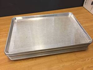 lot 63 image: 12 Aluminum Perforated Bun Pans