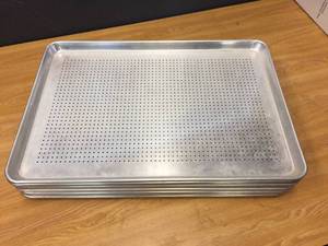 lot 62 image: 12 Aluminum Perforated Bun Pans