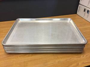lot 61 image: 12 Aluminum Perforated Bun Pans