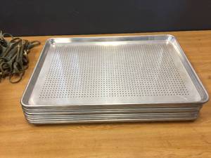 lot 58 image: 12 Aluminum Perforated Bun Pans