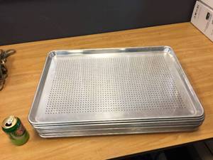 lot 57 image: 12 Aluminum Perforated Bun Pans