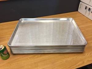 lot 56 image: 12 Aluminum Perforated Bun Pans