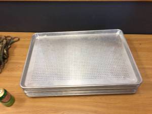 lot 55 image: 12 Aluminum Perforated Bun Pans