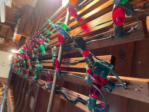 lot 89 image: Vintage Christmas Lights Attached to Gutter Boards