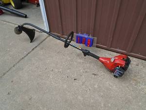 Homelite weed trimmer. Lightly used. Tested & works. As shown.