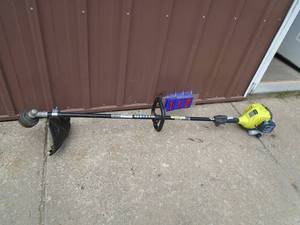 Ryobi gas line trimmer. Lightly used. Tested &n works. As shown.