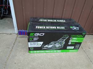 E-go 56 volt self propelled lawn mower with charger. No battery. Unable to fully test. As shown.