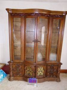 Wood china hutch. 64 x 79 x 15. Very nice condition. Seperate top & bottom. Bring help as item is very heavy. As shown.