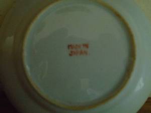 Shelf with miniature cups & saucer. Made in japan. As shown.
