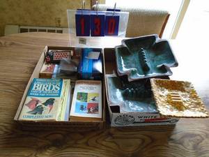 Qty of 2 flats of misc ashtrays & books. As shown.