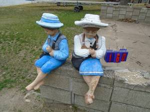 Cement fishing figures. As shown.