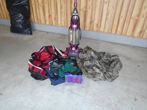 Assorted duffel bags, atv cover & vaccum. As shown.