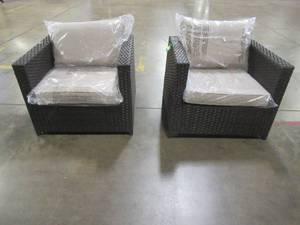 lot 434 image: Xizzi Brown Wicker Outdoor Patio Arm Chairs (One Chair has Back Bottom LH Corner Damage - See Photo) with Tan Cushions. NEW - Unclaimed Freight,