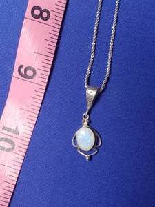lot 214 image: 10 KT chain with 925 Opal pendent
