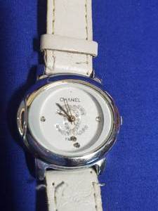 lot 6 image: Chanel watch hour pieces loose and floating within encasement