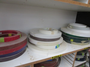 lot 31 image: Edge banding product, three stacks ...