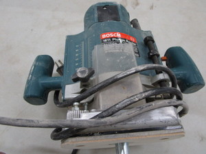 lot 223 image: Bosch 1611 plunge router...
