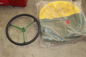 lot 675 image: Tractor Steering Wheel, Seat Cushion